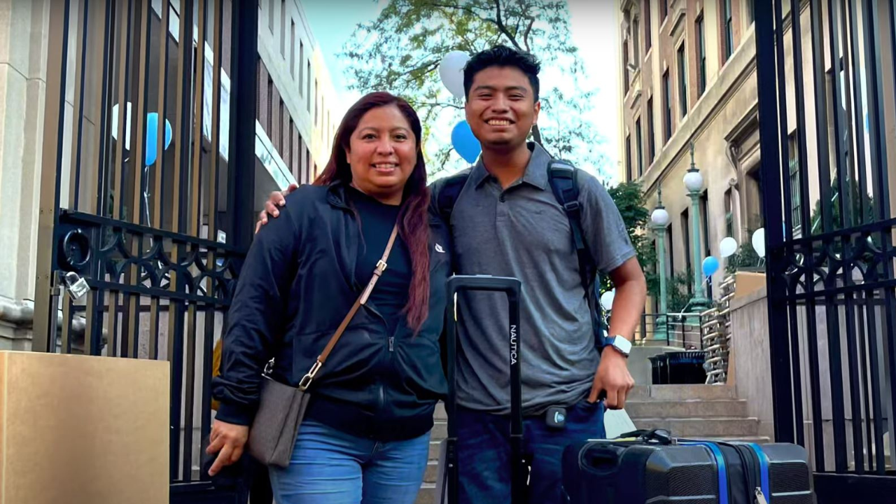 Socorro and Kevin Solis standing in front of the entrance to Columbia University