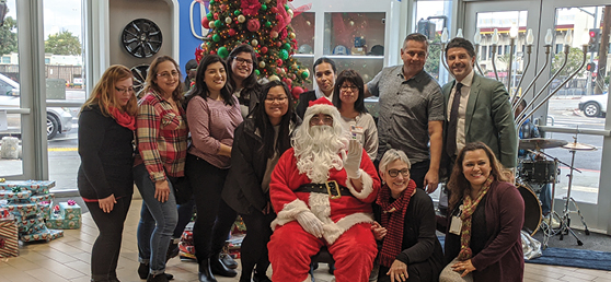 Hope Street Staff smile with Santa