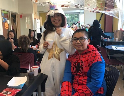 Hope Street Students show off their Halloween costumes, spider-man and a bunny