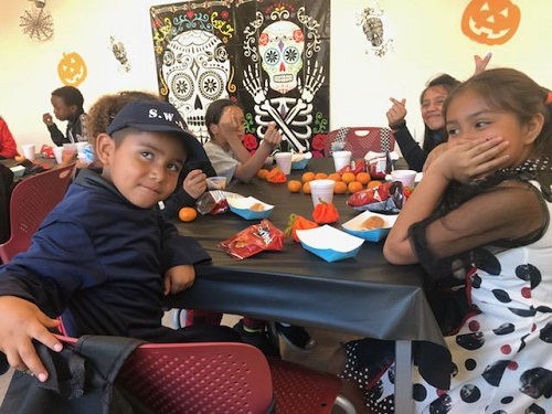 Students enjoy a Halloween snack