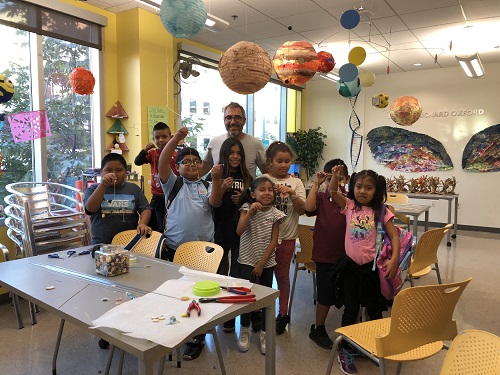 Artist Brad Howe smiles for a group photo with the Hope Street Students