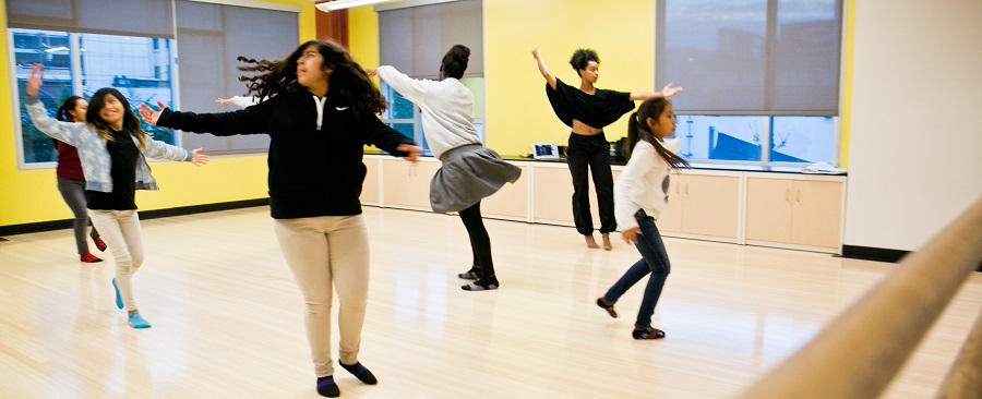 Hope Street Students twirl together in unison during their dance class.